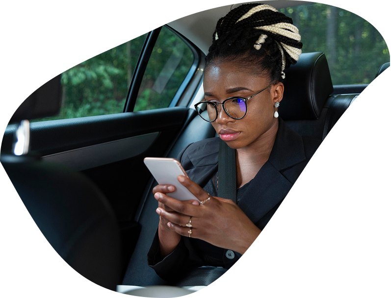 Woman pressing phone in back seat